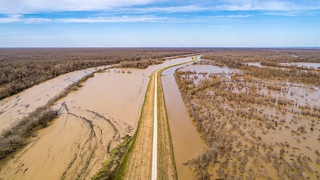 Muddy floodwater backwater aerial