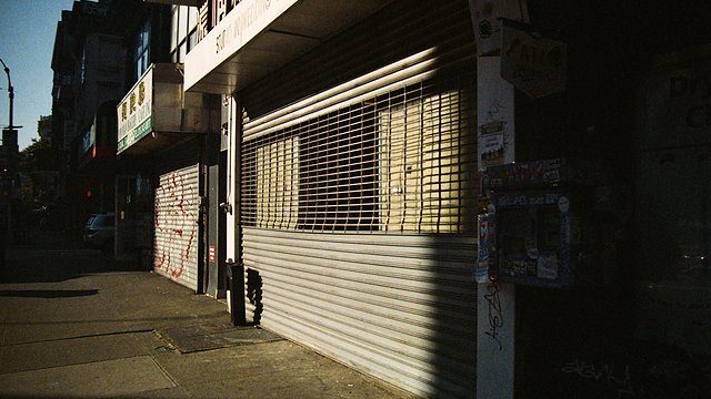 Boarded storefront dusk