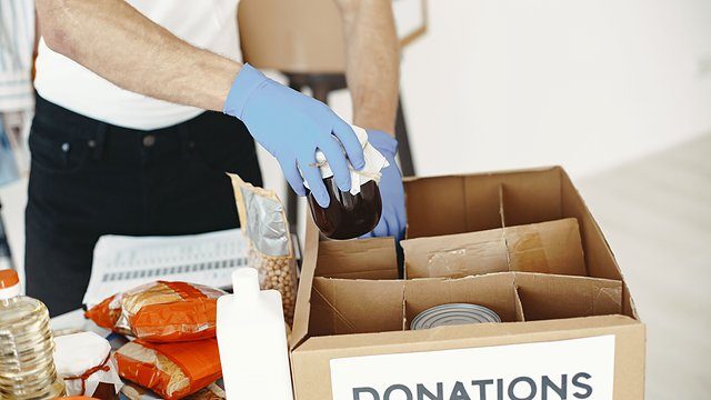 Donations box hands