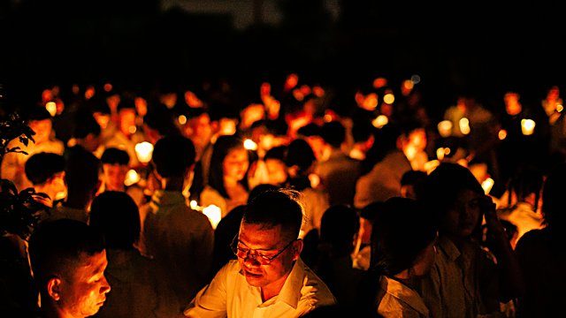 Candlelight vigil crowd night