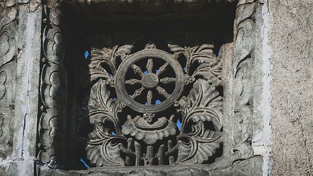 Dharma wheel stone carving