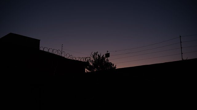 Barbed wire twilight silhouette